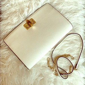 White BEBE clutch with detachable shoulder strap